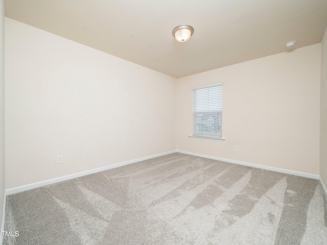 1218 S Franklin St, Wake Forest, NC 27587 - carpeted empty room featuring baseboards