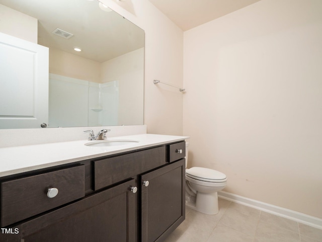 1218 S Franklin St, Wake Forest, NC 27587 - full bathroom with toilet, vanity, baseboards, and tile patterned flooring