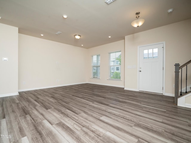 1218 S Franklin St, Wake Forest, NC 27587 - entryway featuring stairway, wood finished floors, baseboards, and recessed lighting