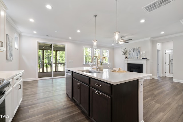 425 Shadow Falls Dr, Wendell, NC 27591 - kitchen featuring a sink, ornamental molding, appliances with stainless steel finishes, light countertops, and recessed lighting