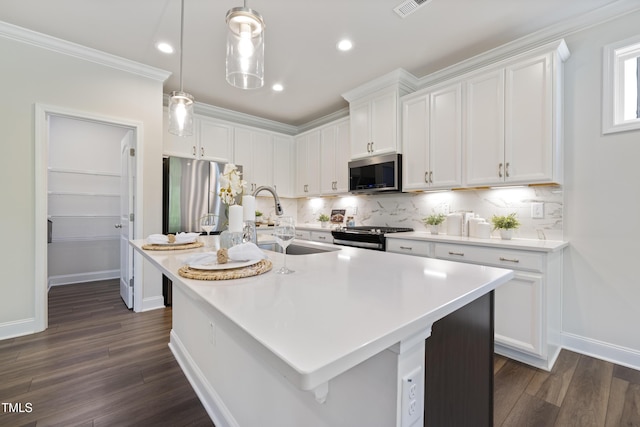425 Shadow Falls Dr, Wendell, NC 27591 - kitchen with appliances with stainless steel finishes, a sink, tasteful backsplash, dark wood finished floors, and recessed lighting