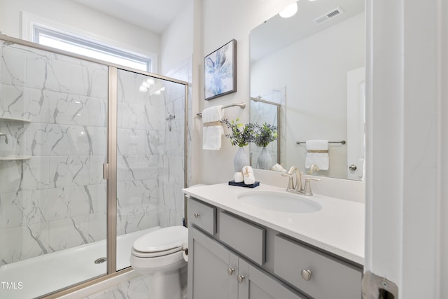 425 Shadow Falls Dr, Wendell, NC 27591 - bathroom featuring marble look tiles, toilet, vanity, and a shower stall