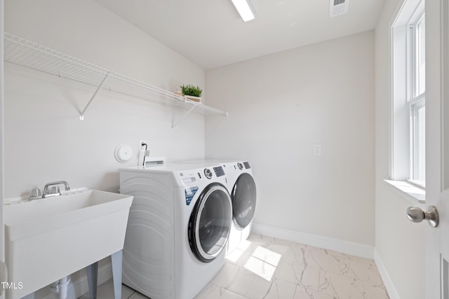 425 Shadow Falls Dr, Wendell, NC 27591 - washroom with light marble finish flooring, separate washer and dryer, and baseboards