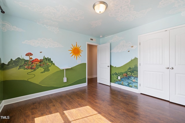 425 Shadow Falls Dr, Wendell, NC 27591 - unfurnished bedroom with wood finished floors, a closet, and baseboards