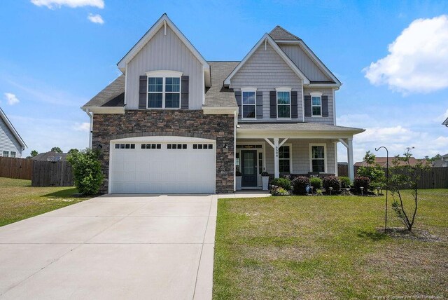 6528 Carswell Dr, Fayetteville, NC 28311 - craftsman house with covered porch, fence, and a front lawn