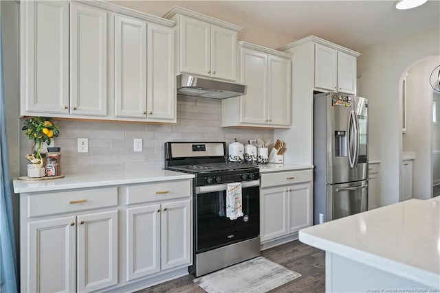 6528 Carswell Dr, Fayetteville, NC 28311 - kitchen with appliances with stainless steel finishes, light countertops, arched walkways, backsplash, and under cabinet range hood