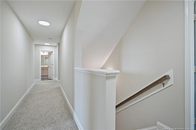 6528 Carswell Dr, Fayetteville, NC 28311 - hall with carpet floors, baseboards, and an upstairs landing