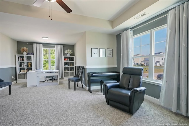 6528 Carswell Dr, Fayetteville, NC 28311 - living area with carpet floors, a ceiling fan, and visible vents