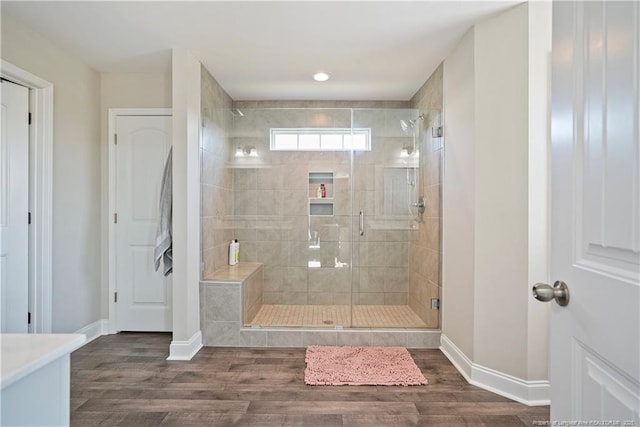 6528 Carswell Dr, Fayetteville, NC 28311 - full bath with baseboards, a shower stall, and wood finished floors