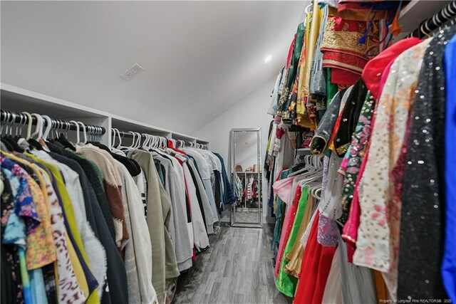 6528 Carswell Dr, Fayetteville, NC 28311 - walk in closet with vaulted ceiling and wood finished floors