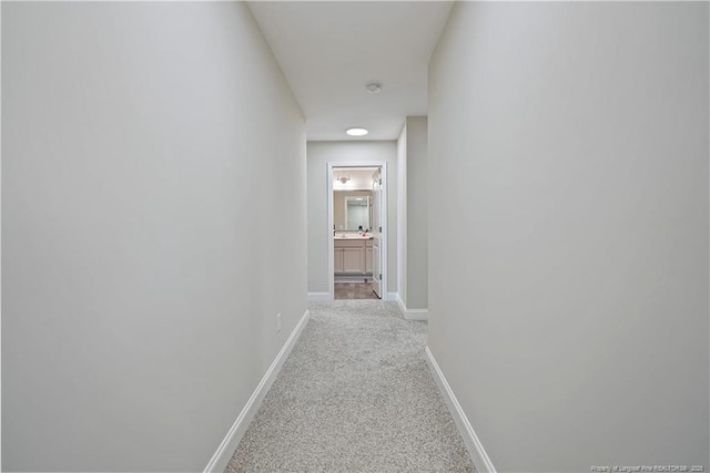 6528 Carswell Dr, Fayetteville, NC 28311 - hallway with baseboards and carpet flooring