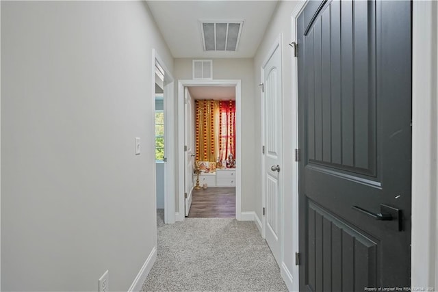 6528 Carswell Dr, Fayetteville, NC 28311 - hallway with carpet floors, baseboards, and visible vents