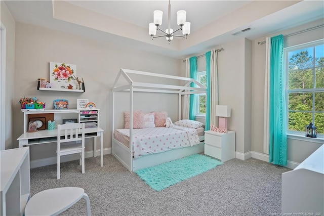 6528 Carswell Dr, Fayetteville, NC 28311 - bedroom with an inviting chandelier, a raised ceiling, carpet floors, baseboards, and visible vents