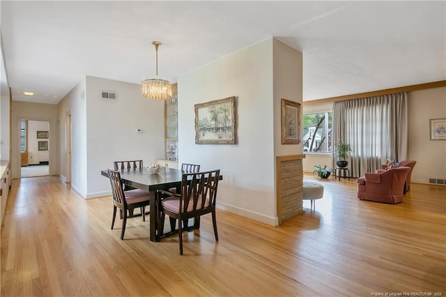 219 Devane St, Fayetteville, NC 28305 - dining area featuring baseboards, visible vents, an inviting chandelier, and light wood-type flooring
