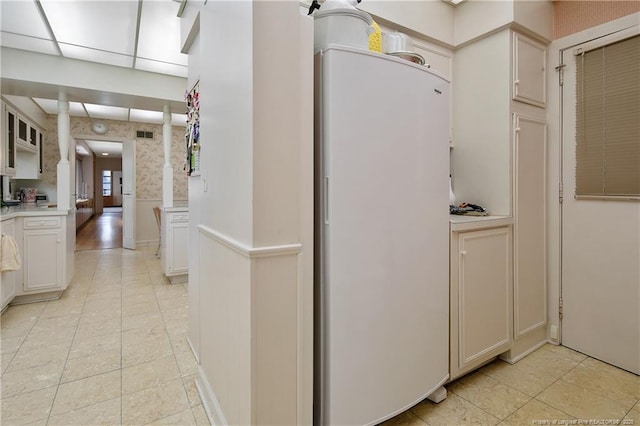 219 Devane St, Fayetteville, NC 28305 - hall with light tile patterned flooring, visible vents, and a wainscoted wall
