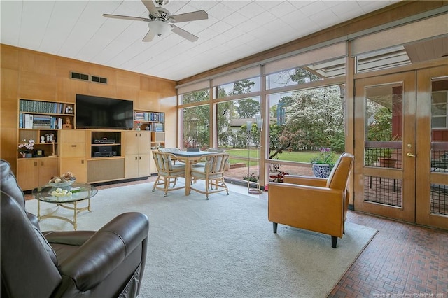 219 Devane St, Fayetteville, NC 28305 - interior space with wooden walls, brick floor, french doors, and visible vents