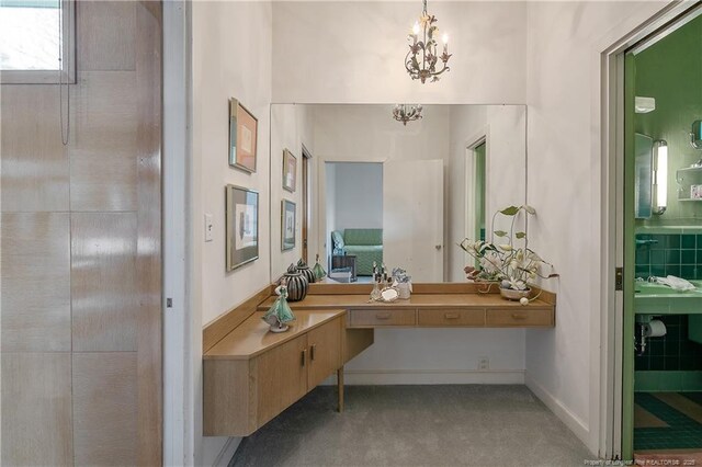 219 Devane St, Fayetteville, NC 28305 - corridor with an inviting chandelier and carpet flooring