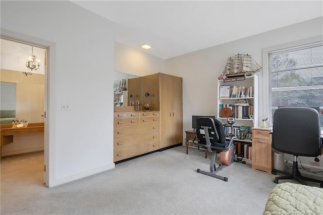 home office with baseboards, light carpet, and a chandelier