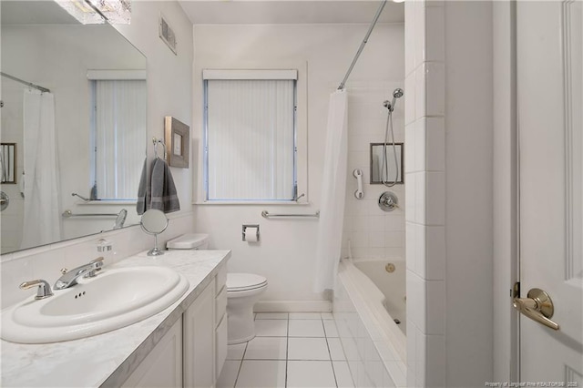 219 Devane St, Fayetteville, NC 28305 - full bathroom featuring visible vents, tile patterned floors, vanity, toilet, and shower / bath combo with shower curtain
