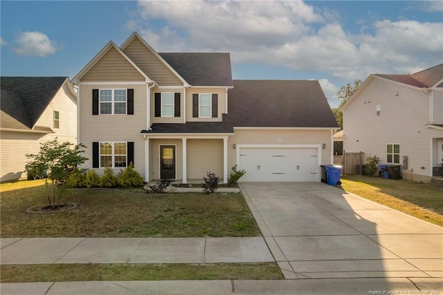 2109 Stonewash Dr, Fayetteville, NC 28306 - traditional home with an attached garage, fence, a front yard, and concrete driveway