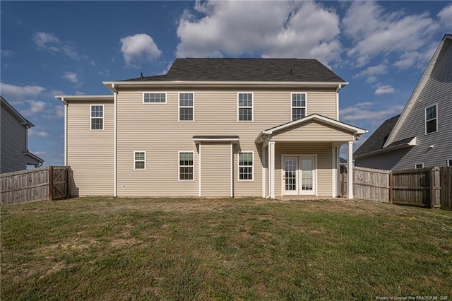 2109 Stonewash Dr, Fayetteville, NC 28306 - rear view of house with a lawn, french doors, and a fenced backyard