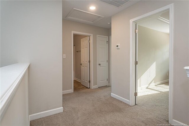 2109 Stonewash Dr, Fayetteville, NC 28306 - hallway featuring baseboards, carpet, attic access, and visible vents