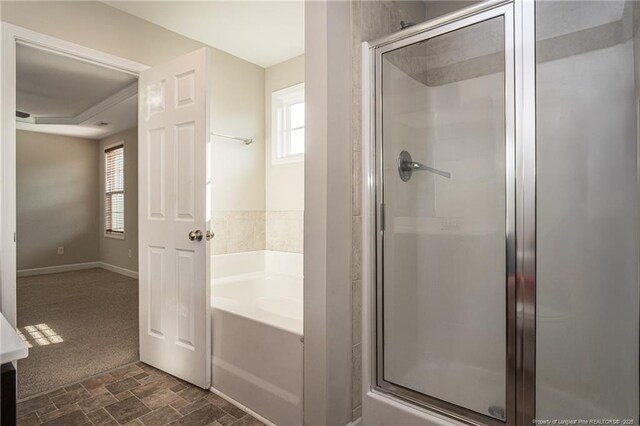 2109 Stonewash Dr, Fayetteville, NC 28306 - full bath with a bath, a wealth of natural light, stone finish floor, and a shower stall