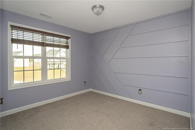 2109 Stonewash Dr, Fayetteville, NC 28306 - carpeted empty room with baseboards and visible vents