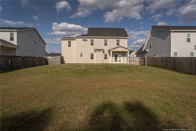 2109 Stonewash Dr, Fayetteville, NC 28306 - rear view of property with a yard and a fenced backyard
