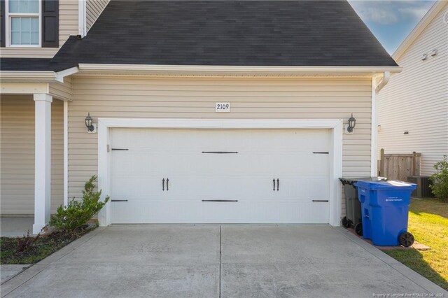 2109 Stonewash Dr, Fayetteville, NC 28306 - garage with central AC unit and driveway