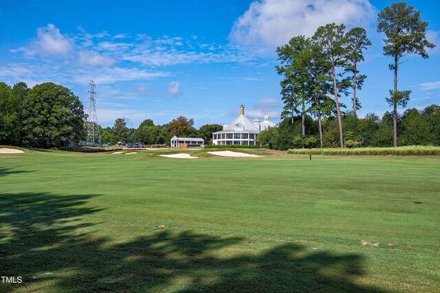 1217 Briar Patch Ln, Raleigh, NC 27615 - view of home's community featuring a lawn, view of golf course, and view of scattered trees