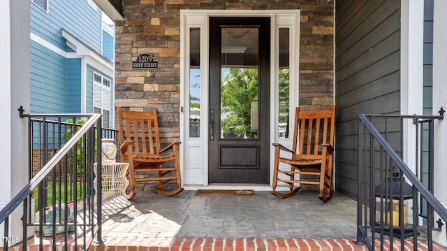 entrance to property with stone siding
