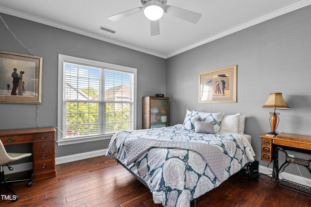 bedroom featuring visible vents, crown molding, baseboards, ceiling fan, and hardwood / wood-style flooring