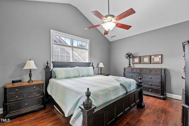 bedroom with visible vents, a ceiling fan, baseboards, dark wood-type flooring, and vaulted ceiling