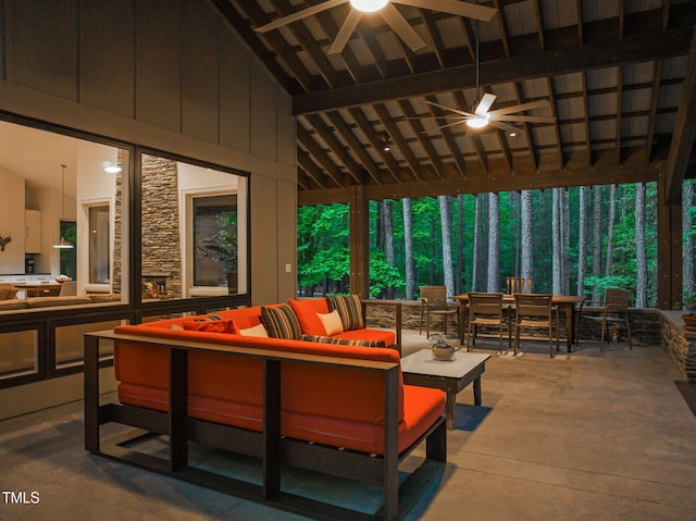 view of patio featuring a ceiling fan, an outdoor living space, outdoor dining space, and an outdoor kitchen