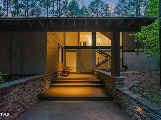view of exterior entry at dusk