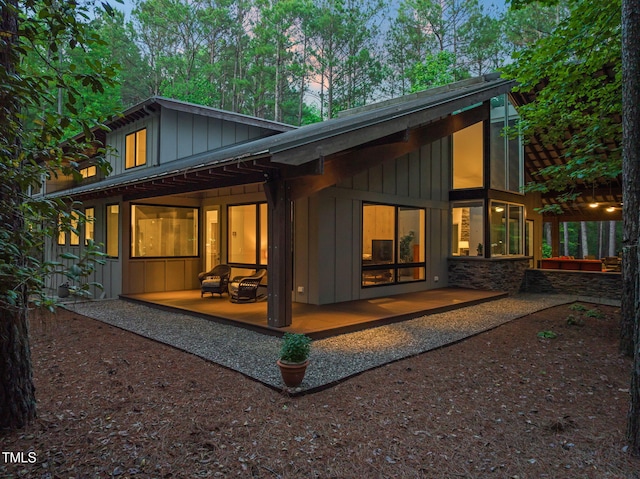 back of house featuring board and batten siding