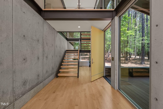 stairway featuring wood finished floors