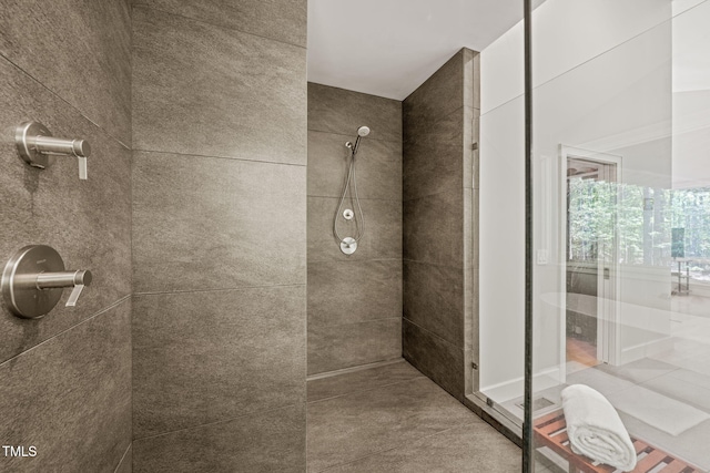 bathroom with tiled shower