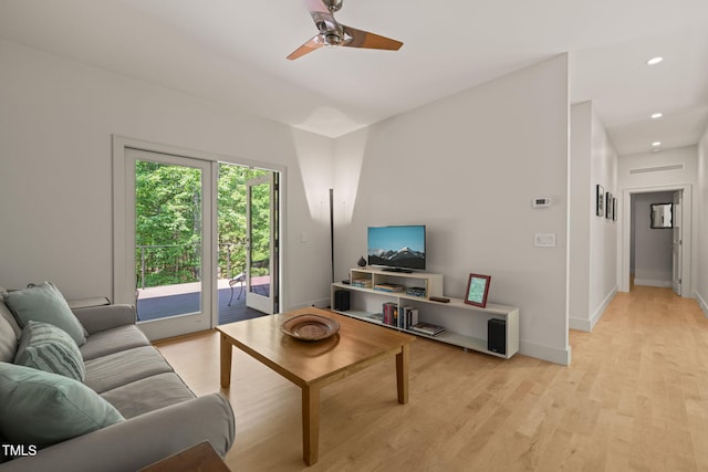 living room with a ceiling fan, light wood-style flooring, baseboards, and recessed lighting