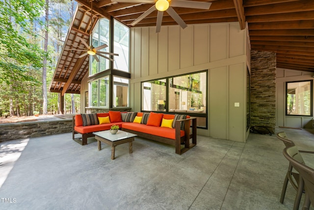 view of patio with ceiling fan and an outdoor living space