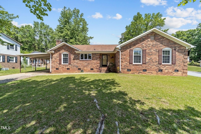 ranch-style home with crawl space, driveway, a chimney, a front yard, and brick siding