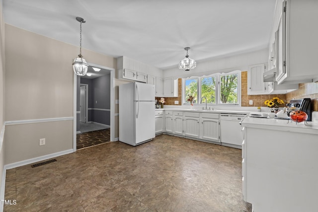 kitchen with a notable chandelier, a sink, white appliances, decorative backsplash, and visible vents