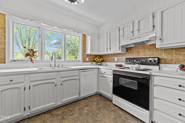 kitchen with a sink, under cabinet range hood, a wealth of natural light, and white appliances