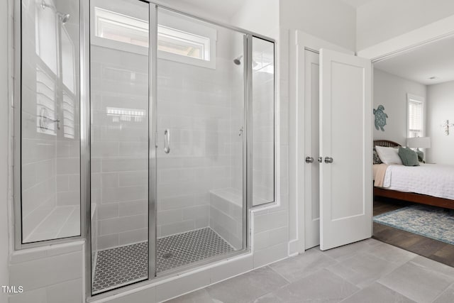 ensuite bathroom with ensuite bathroom and a shower stall