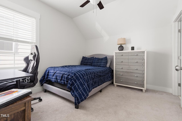 carpeted bedroom featuring baseboards, ceiling fan, and vaulted ceiling