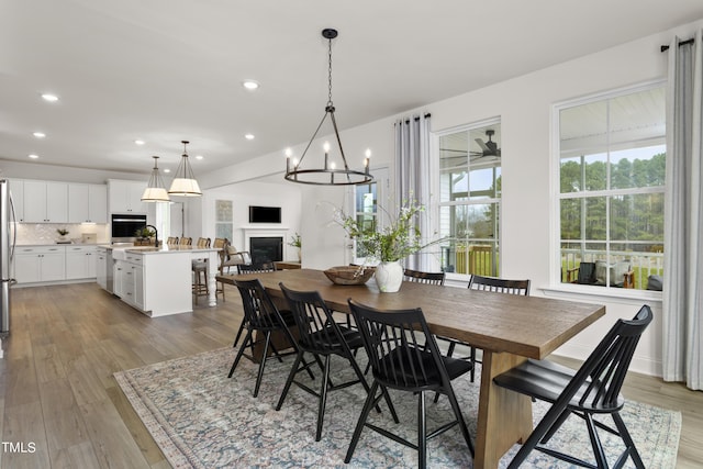 264 Alden Way, Angier, NC 27501 - dining space featuring recessed lighting, a fireplace, and light wood finished floors