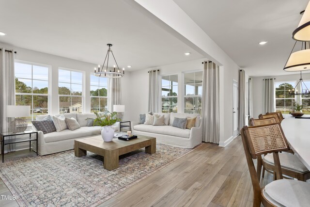 264 Alden Way, Angier, NC 27501 - living area with light wood-type flooring, recessed lighting, and a notable chandelier