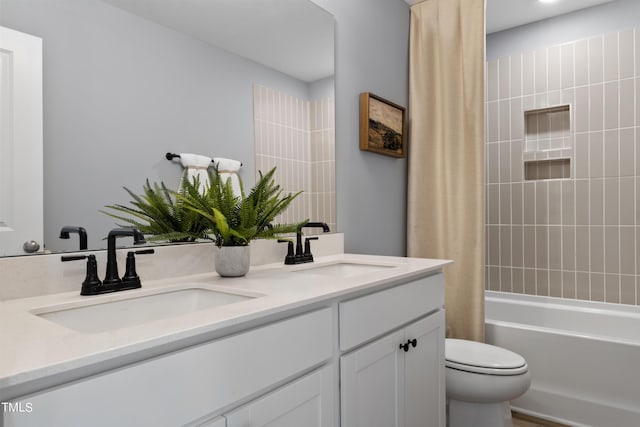 264 Alden Way, Angier, NC 27501 - bathroom with double vanity, toilet, a sink, and shower / bath combo with shower curtain