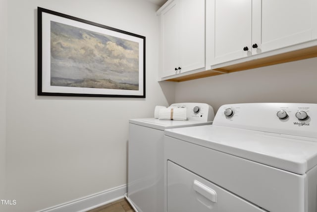 264 Alden Way, Angier, NC 27501 - laundry area with washing machine and clothes dryer, baseboards, wood finished floors, and cabinet space